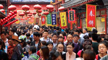 BEIJING - People crowd famous Wangfujing snack street during National Day holiday