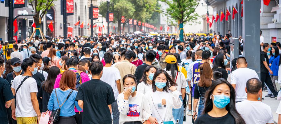 Crowd of Chinese people wearing surgical face mask