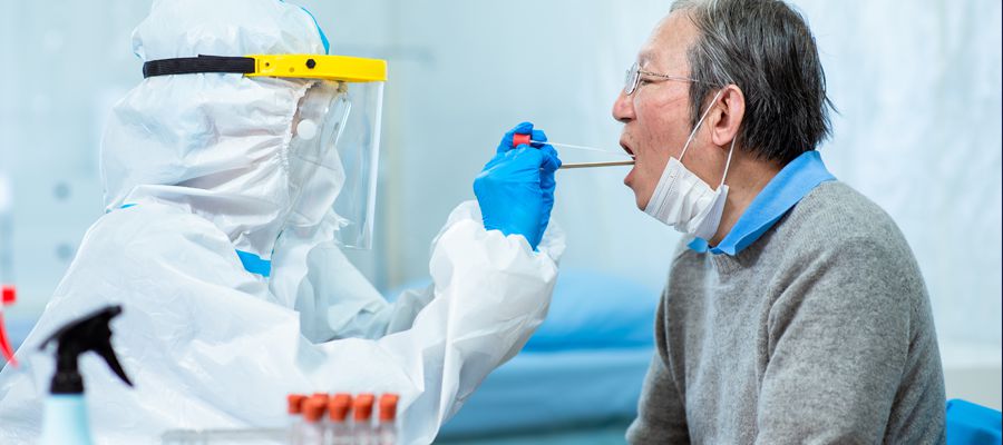 Coronavirus test - Medical worker taking a throat swab for coronavirus sample