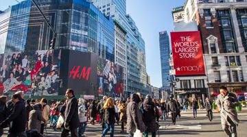 Busy street view in midtown Manhattan at Herald Square