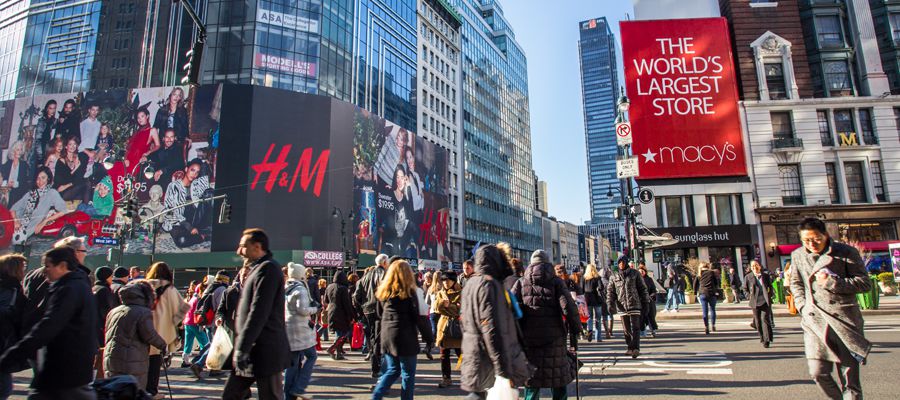 Busy street view in midtown Manhattan at Herald Square