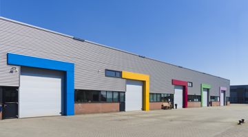 modern business units with colorful roller doors