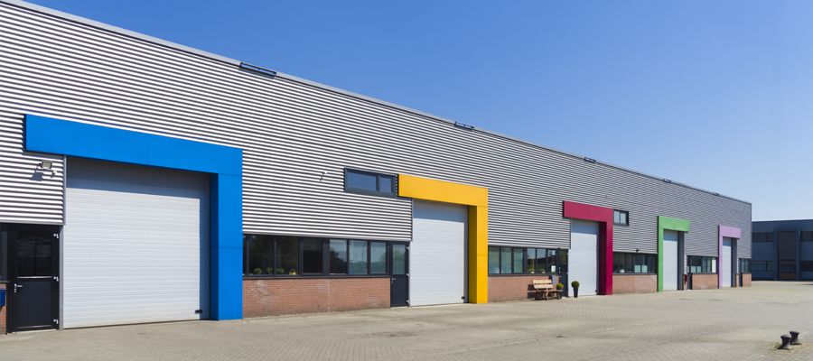 modern business units with colorful roller doors